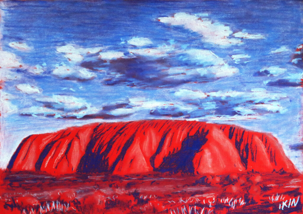 Drawing of Uluru using blue and white pastel on red paper