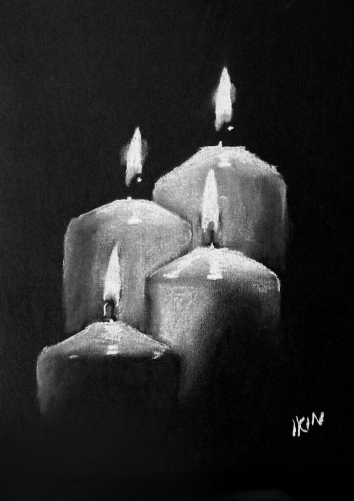 Drawing of candles on black paper